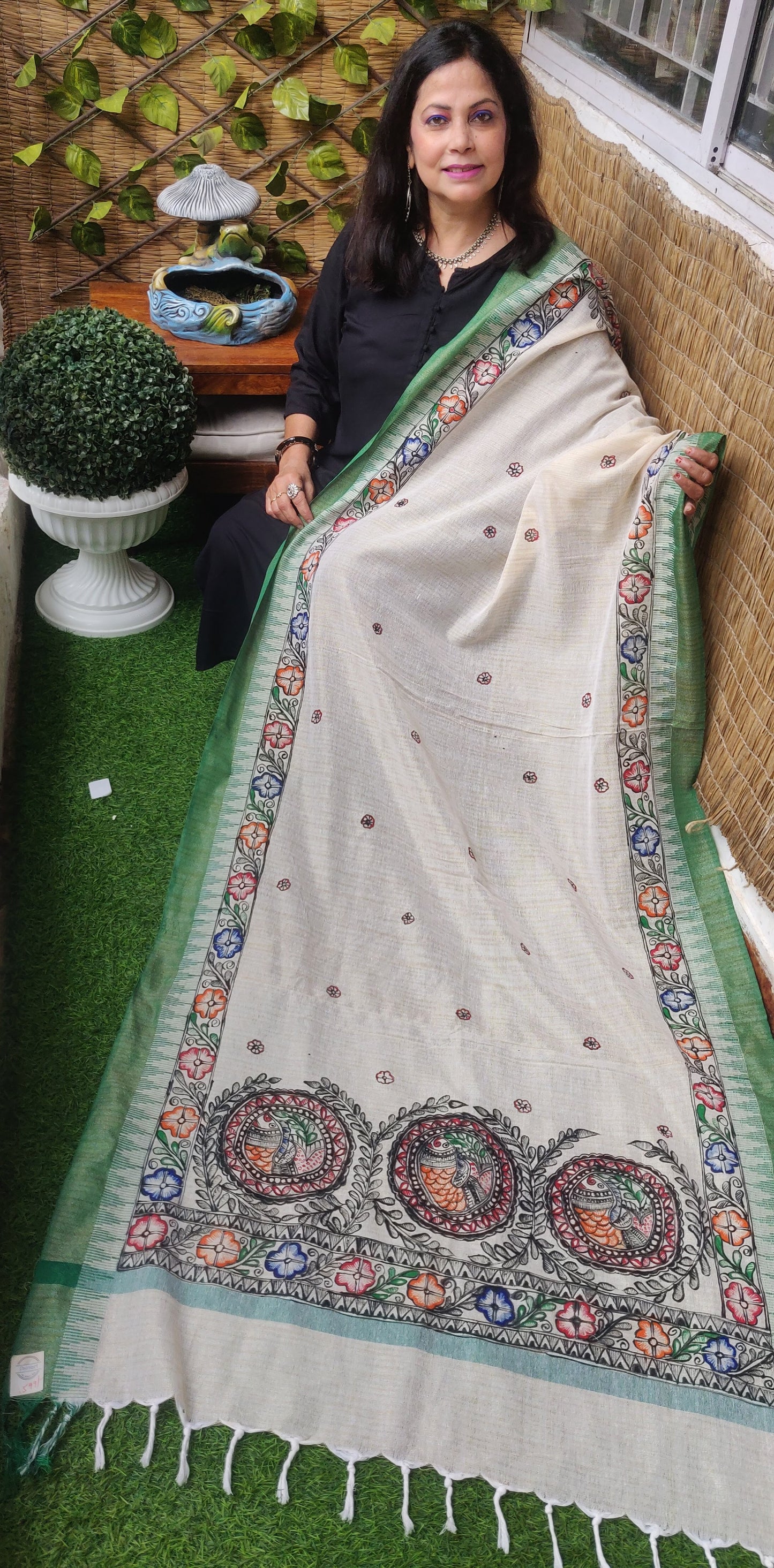 Handpainted madhubani art flower and fish motifs on cream cotton dupatta with green border