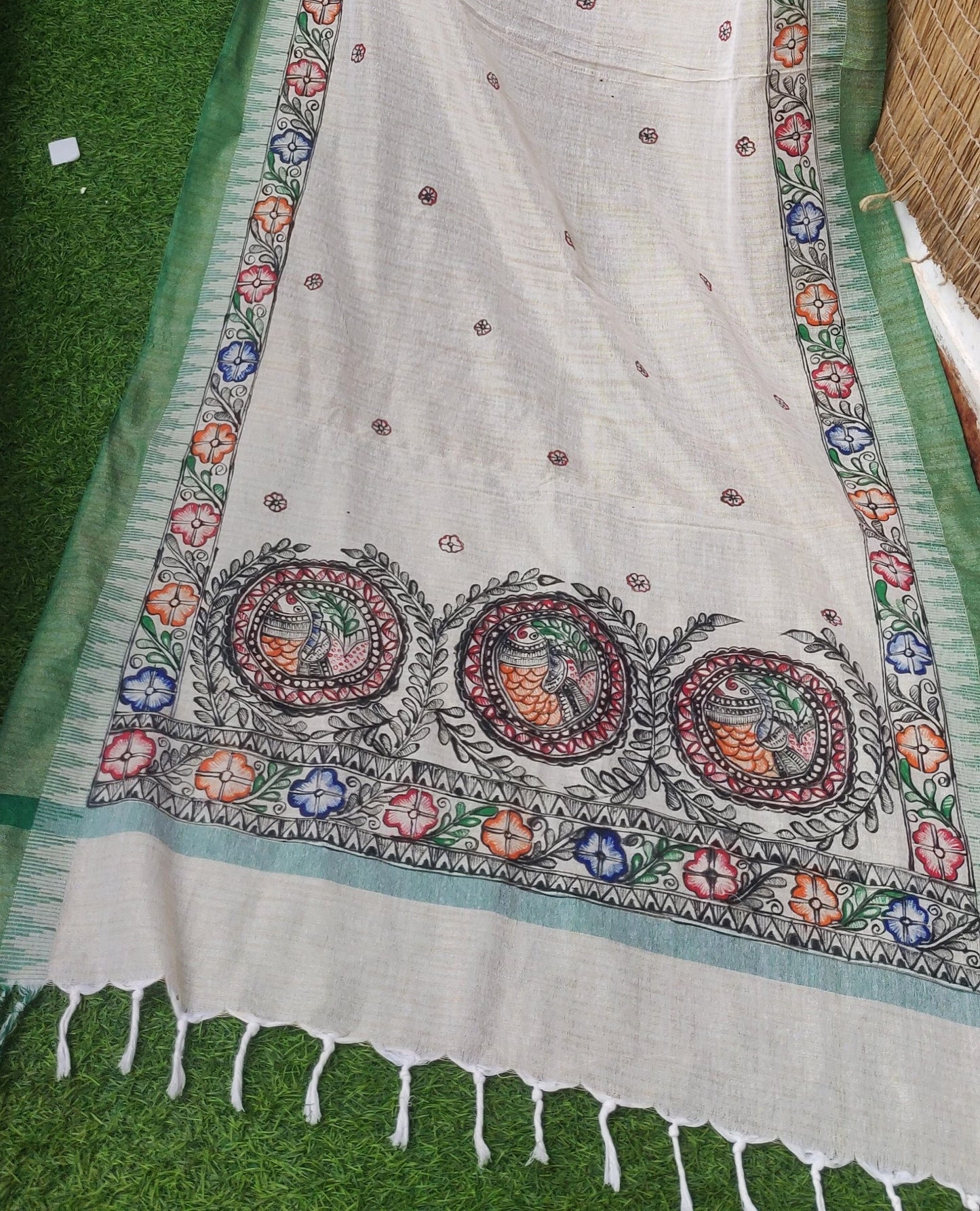 Handpainted madhubani art flower and fish motifs on cream cotton dupatta with green border