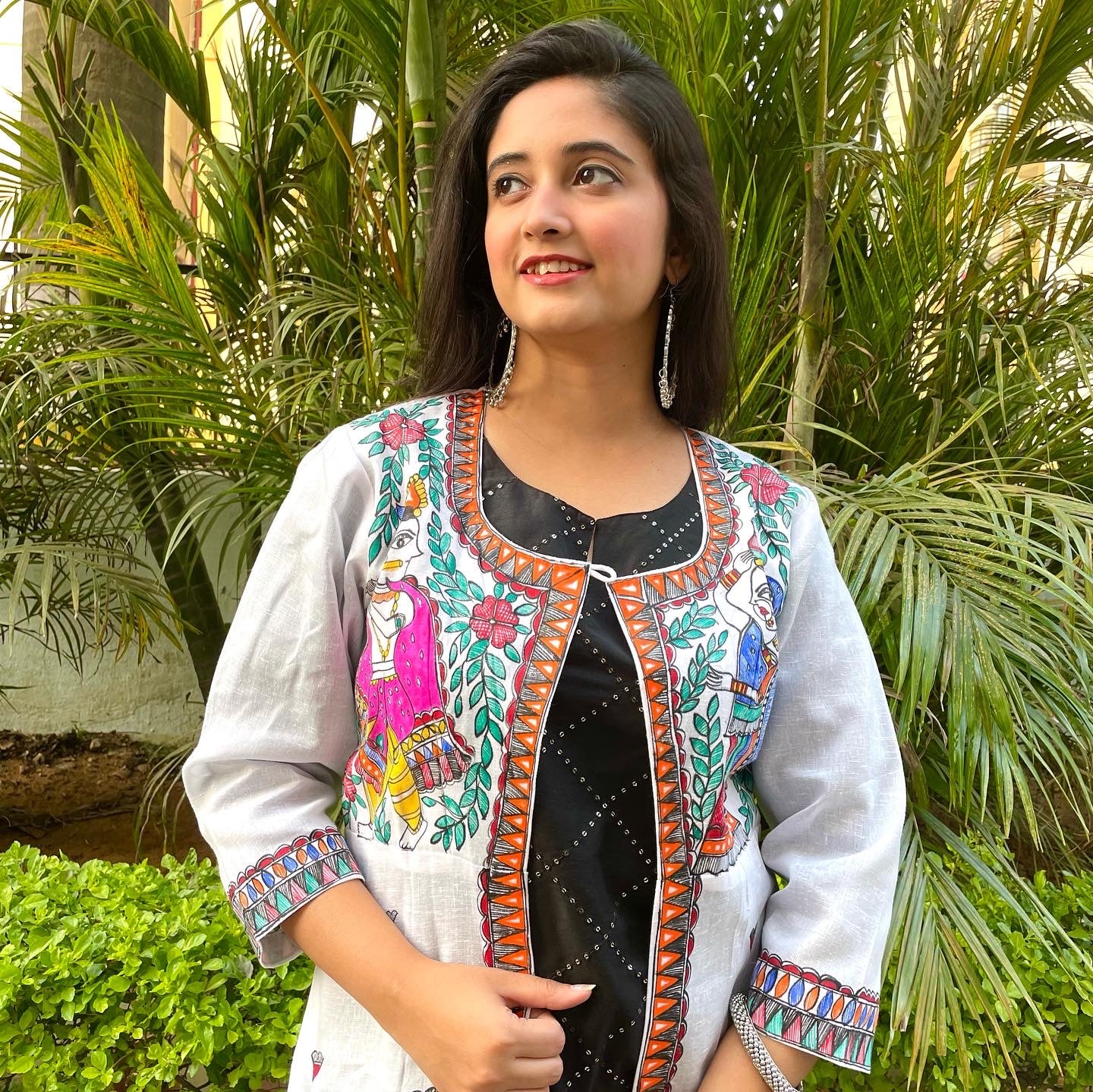 Handpainted madhubani art white base shrug with radha krishna motifs on front and krishna motif on back